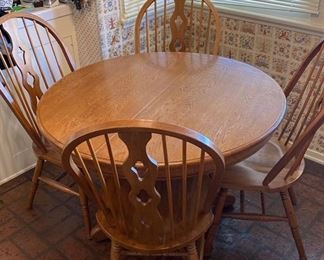 Kitchen Table, Round with 4 chairs and a leaf.