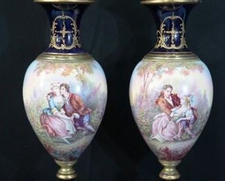 Large pair of 19th Century Sevres scenic figural urns, artist signed J. Pascal.