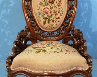 2 - Rosewood rococo heavily carved parlor chair, by George Henkels in great condition with needlepoint upholstery, 39 in. T, 26 in. W, 22 in. D.