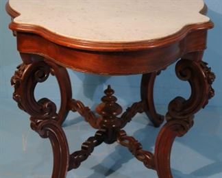 128 - Walnut Victorian marble top center table, 29 in. T, 49.5 in. L, 31.5 in. W.
