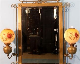218 - Brass Victorian hanging mirror with 2 oil lamps, still oil with hand painted shades, 45 in. T, 37 in. W.