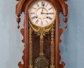 327 - Walnut Victorian style wall clock with key and pendulum, has all parts, 35 in T, 15 in. W. not old