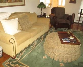 Living Room Suite ~ Entertainment Center~ Rolling Ottoman ~ Rugs ~ Sofa ~ Wall Art 