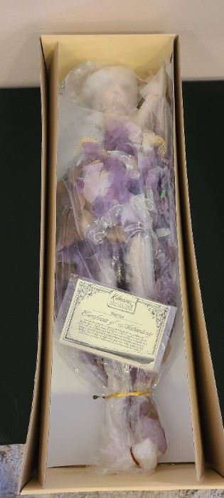 28" Katherine's Collection "Beatrice" purple fairy, she has never been removed from her packing or box. The last photo is a stock photo of what she looks like displayed.