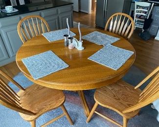 Round oak table and 4 chairs 
