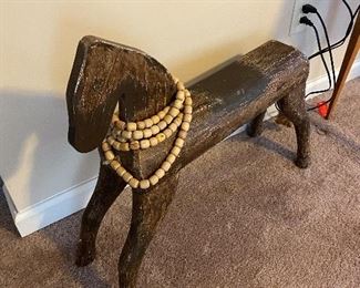 Wooden horse with beads.