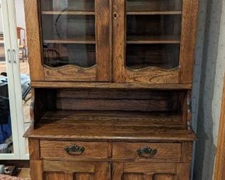 Vintage Wood Display Hutch.

A charming piece for storage or displaying your treasures! Measures 37.5” wide, 17.5” deep and 79” high