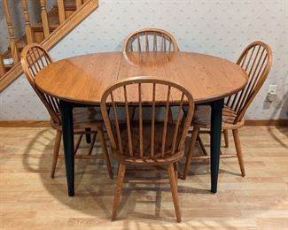 Nice Wood Dining Set. Includes two leaves and is pictured with one. The table measures 54” x 42” and 30” high. 