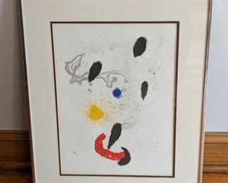 Framed “Composition B” Lithograph by Joan Miro. Includes the certificate of authenticity and measures 16” x 20”.