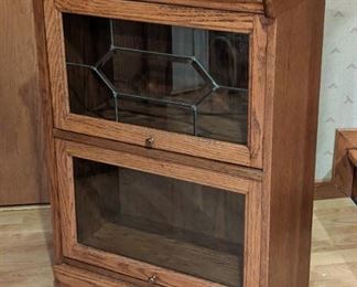 Petite Barrister Bookcase with leaded glass door front.

Measures 24” wide, 13” deep and 34” high.