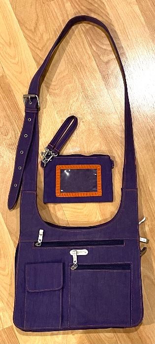 Baggallini Handbag with Attachable Wallet is in a gorgeous hue of violet. The handbag measures 11x9x3 inches. 