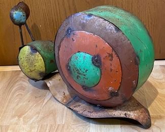 Whimsical Metal Snail measures 16x10x7 inches