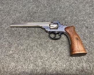 Next
928.23
Harrington & Richardson Arms Co. Premier flip top 6 shot revolver, serial #494008, caliber 22 rim fire, 6” barrel, clean bore, wood grips, crack in right grip, little wear on the end of the barrel. Includes a Red Head leather holster.  (B4-139)