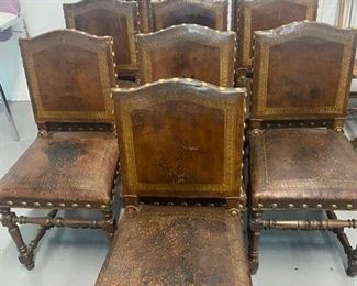 10 Spanish style embossed leather chairs.