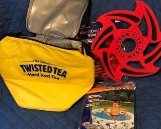 blow up kiddie pool, twisted tea insulated bag, flag and toy