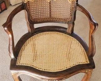 Stylish Louis XV style armchair with caned back and seat