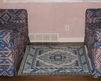 Matching love seats in Southwestern pattern.  