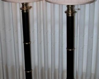 Pair of floor lamps in ebony and brass