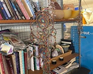 Loads of books and dream catchers and spiritual pictures