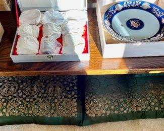 Pillows shown under the low wood table