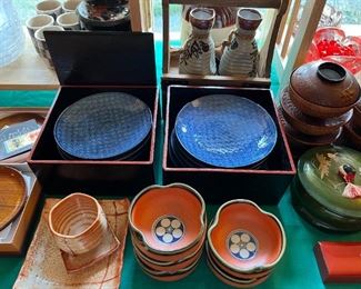 Porcelain plates in wood boxes, pottery bowls