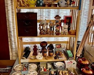 Lots of small items, mostly Japanese: dishes, saki cups, rice bowls, Kokeshi dolls