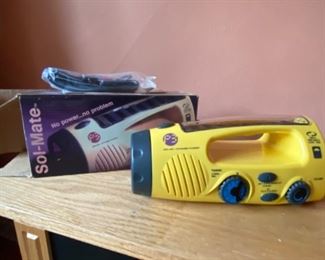 Solar and crank charge emergency flashlight siren radio combo 