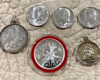 1921 silver dollar, .999 Happy Holidays troy ounce coin, .999 liberty half dollar, 3 1964 Kennedy half dollars (front view)
