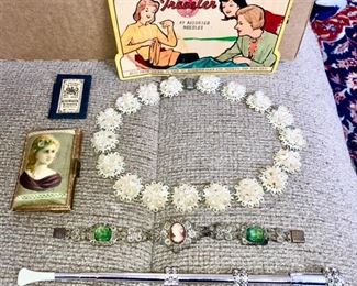 Antique "The pocket Needle Case" (with Victorian lady), vintage thermoset plastic necklace, antique cameo/green rhinestone bracelet, vintage extendable cigarette holder w/ rhinestones
