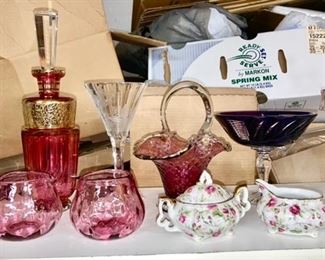 Cranberry cut to clear crystal decanter, cranberry creamer & sugar, basket, amethyst cut to clear footed compote, porcelain creamer & sugar