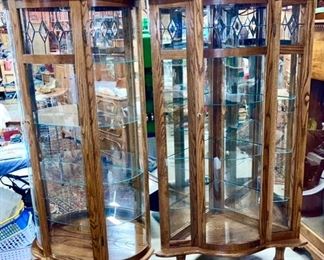 Another picture of both modern curio cabinets 
