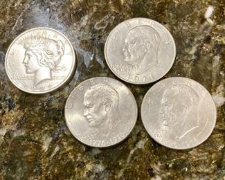 1923 Liberty silver dollar, 3 Eisenhauer silver dollars (1971 and two 1776-1976)