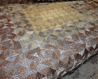 Large Quilt on the King Bed (gray underneath )