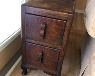 There are a pair of these 1920's  2-drawer tables! Make great chair-side tables or night stands!