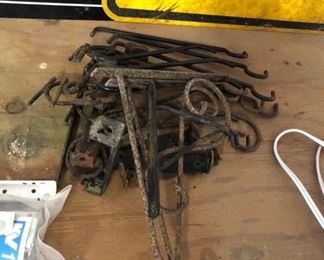 a pile of metal plant brackets