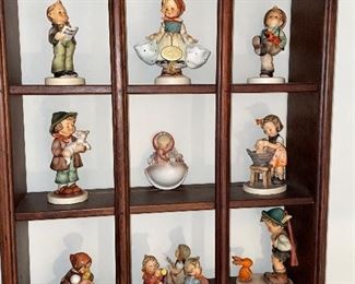 Sweet display cabinet with Hummel figurines