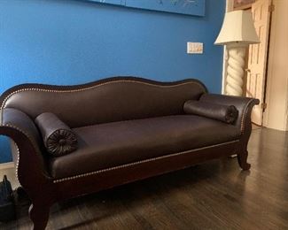 Camel back sofa custom covered in chocolate leather with brass tack trim, Post-modern MCM twist floor lamp