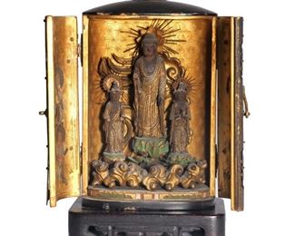 Lot 78  |  RARE LACQUER & GILT "ZUSHI" TRAVEL SHRINE  |  The gilt interior showing Buddha on a lotus flanked by two bodhisattvas
h. 5-1/4 in.