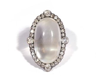 Lot 101  |  IMPORTANT ANTIQUE MOONSTONE RING  |  Designed as an impressive approximately 30 carat oval cabochon moonstone (26 x 15.3 x 7.25 mm), centered by four 1/4 carat old mine cut diamonds in a border of antique full cut melee diamonds, set in platinum and 14k yellow gold, in a fitted antique box; 10.8g

With original receipt and handwritten note explaining the provenance of the ring, both signed by Edward Good (Oyved Moysheh), and with various appraisal documents