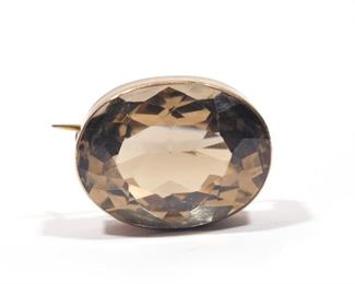 Lot 103  |  28 CARAT ANTIQUE CITRINE BROOCH  |  Faceted citrine measuring approximately 24 x 18.5 x 12.7mm, mounted in a gold surround
Measurements are approximate (due to mounting); weight is approximate (calculated from measurements)  