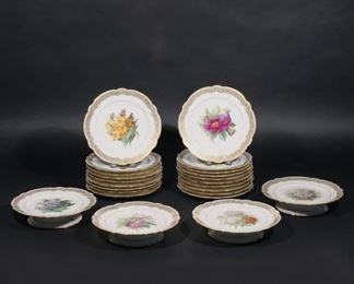 Lot 138  |  (23PC) PARISIAN HAND-PAINTED DESSERT PLATES  |  Set of 19 dessert plates with flowers and gilt Greek key scalloped rims (dia. 9 in.), plus 4 matching serving dessert plates (h. 9 x dia. 2 in.) by Pillivuyt et Cie, La Porcelain de France, 1855