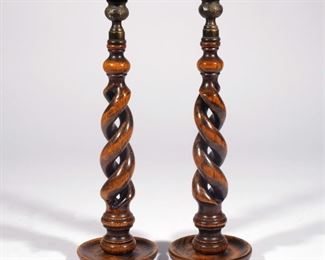 Lot 143  |  PAIR BARLEY TWIST TURNED WOOD CANDLESTICKS  |  Open carved barley twists with chased bronze bobeches
h. 14 in.