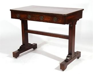 Lot 147  |  REGENCY INLAID WRITING TABLE, C. 1820  |  Having over hanging top with reeded edge, over two frieze drawers, mounted on trestle ends resting on platform with scroll knee and base supports, attached by medial stretcher bar, mounted on casters
h. 28-1/2 w. 35 d. 21-1/2 in.