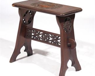 Lot 151  |  RARE TRYON TOYMAKERS CARVED GOTHIC BENCH  |  Tryon, North Carolina, 20th century, branded: "The Tryon Toy Makers / Registered / Made in the Mountains of North Carolina"
h. 17 w. 18 d. 9-1/2 in.