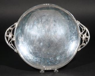 Lot 194  |  LILY OF THE VALLEY STERLING TRAY  |  Having openwork lily of the valley handles, with maker's mark on the bottom; 16.8 ozt w. 13-1/2 d. 10-3/4 in.