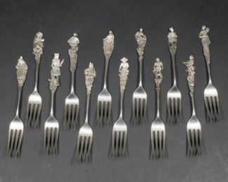 Lot 200 |  (12PC) GORHAM NUREMBURG STERLING SILVER FORKS  |  A set of 12 forks in Gorham's "Nuremberg" pattern, pat. 1885, with figural handles; all together 10 ozt