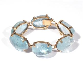 Lot 217  |  UNTREATED AQUAMARINE & 14K BRACELET  |  Designed as six amorphous aquamarine links on a 14k yellow gold bracelet; 6-3/4 in., 50.4g