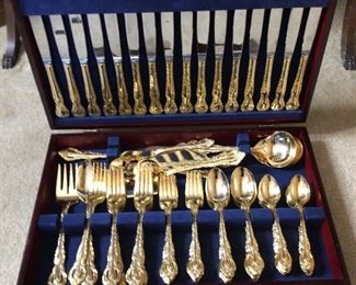 Wallace baroque goldplated silverware. Service for 16