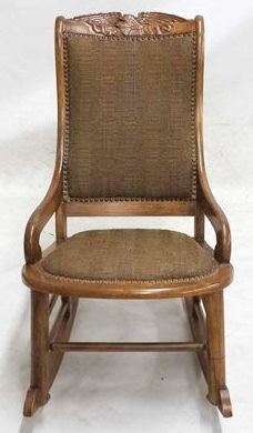 2057 - Eagle carved & upholstered rocking chair 33 1/2 x 20 x 32 1/2
