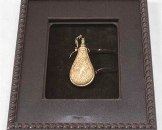 2080 - Carved powder flask in shadowbox 19 x 17 no glass
